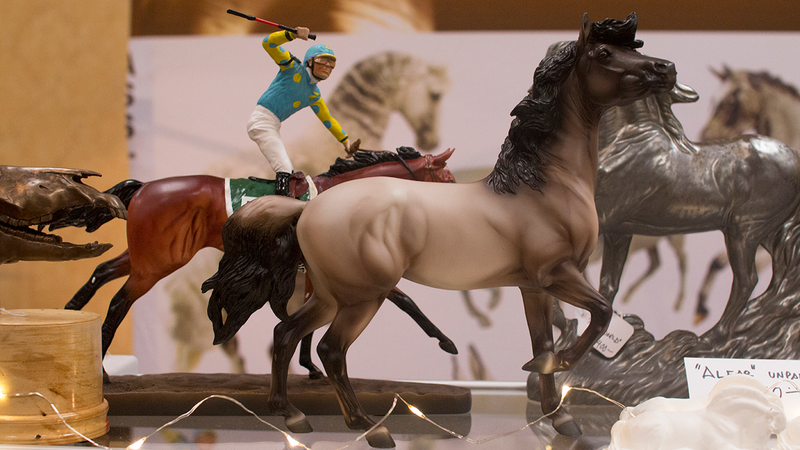 Model horses being sold at the Clarion Inn’s “artist’s alley” room.